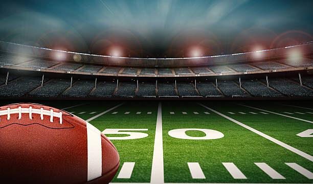 3d Rendering American Football Ball On Green Field